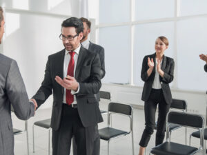 handshake after the completion of a new project plan